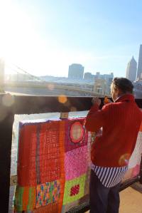 Art quilter Tina Williams Brewer enjoys the morning sun while she works. Photo: Staci Offutt